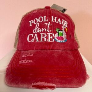 CC Beanie Ponytail Cap with embroidery on the front.